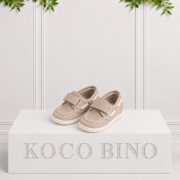 Boys stone boat shoes by Koco Bino with Velcro straps, contrast stitching, rope-style eyelet details and textured off-white soles for smart summer outfits.