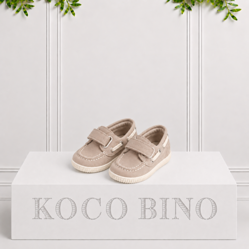 Boys stone boat shoes by Koco Bino with Velcro straps, contrast stitching, rope-style eyelet details and textured off-white soles for smart summer outfits.