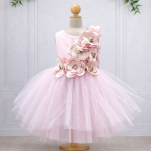 Blush pink Koco Bino Couture occasion dress with layered tulle skirt and handcrafted 3D floral appliqués on a display mannequin.