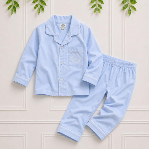 Light blue boys cotton pyjamas with white piping, long sleeve button shirt and matching trousers, premium children's sleepwear by Koco Bino.
