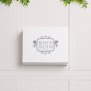 Luxury Koco Bino baby gift box in elegant white keepsake packaging, perfect for presenting a baby girl gift set or newborn gift.