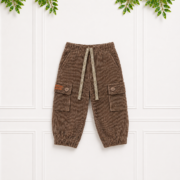 Brown boys' corduroy cargo pants with an elasticated waistband, adjustable drawstring, flap pockets and tapered legs for everyday comfort.