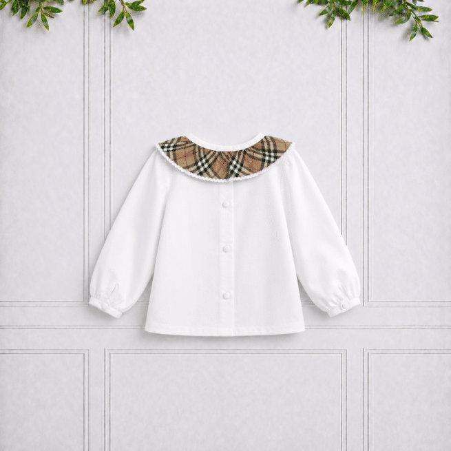 Back view of a white girls' blouse with a checked Peter Pan collar, button fastening and long sleeves, displayed against a neutral studio background.