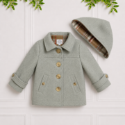 The Shaun Coat features a soft sage outer, checked interior, detachable hood and warm finish for stylish layering.