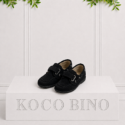 Classic black children's boat shoes with a soft suede finish and hook-and-loop strap, made for smart looks and everyday comfort.