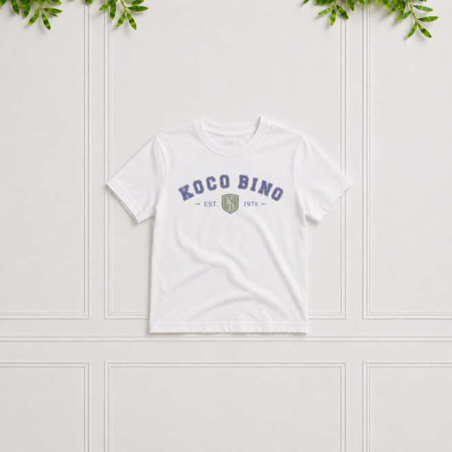 White boys' short sleeve cotton T-shirt with blue Koco Bino varsity print and crew neckline, perfect for casual everyday outfits.