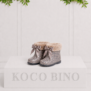 Children's leopard print rain boots with soft faux fur trim and satin bows, combining cosy warmth with playful rainy-day style.