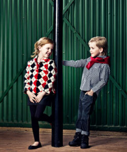 Boy and girl wearing Polo South Africa children's clothing, showcasing classic smart casual outfits with timeless style and iconic quality.