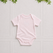 Soft baby pink vest in premium cotton interlock with envelope neckline and elegant white KB embroidery for everyday comfort and style.