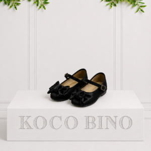 Black children's buckle pumps with oversized satin bows, bringing timeless elegance and comfortable style to every special occasion.