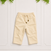 Cream track pants with a soft brushed finish, elasticated waistband, drawstring tie and relaxed straight-leg fit.