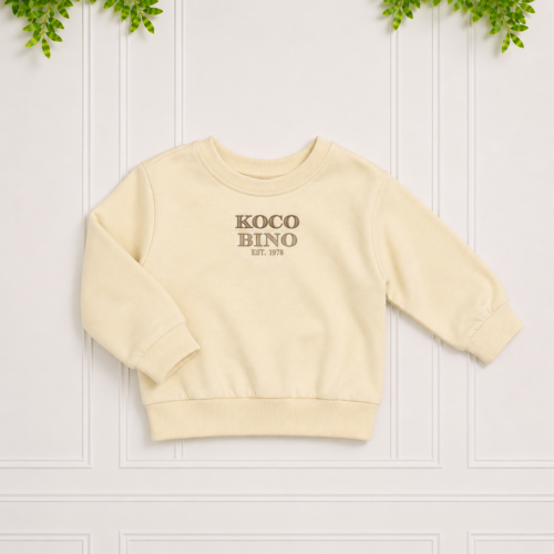 Cream sweatshirt with a cosy crew neckline, ribbed cuffs and waistband, finished with signature Koco Bino chest embroidery.