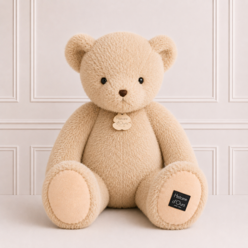 Large beige Histoire d'Ours teddy bear with ultra-soft plush fur, seated against a neutral backdrop, perfect as a timeless keepsake gift for children.