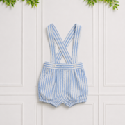 Baby boy romper in blue and white stripes with suspender straps, button waistband and elasticated bloomer-style shorts.
