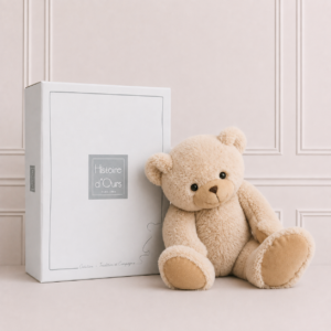 Soft teddy bear in cream plush presented in a luxury gift box, a cuddly keepsake and perfect baby gift for newborns and young children.