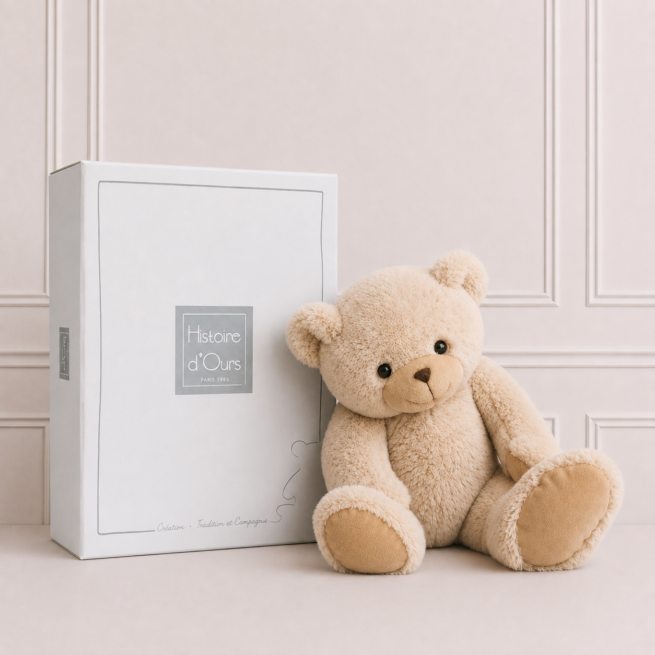 Soft teddy bear in cream plush presented in a luxury gift box, a cuddly keepsake and perfect baby gift for newborns and young children.