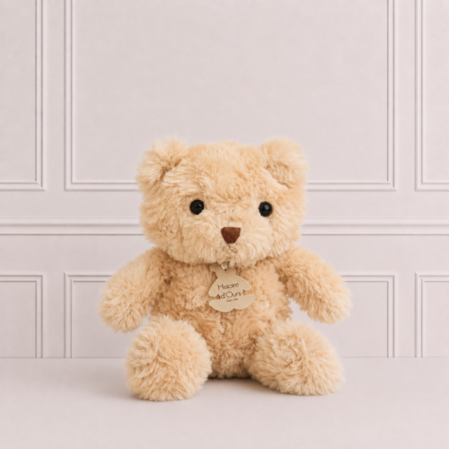 Soft teddy bear by Histoire d'Ours with ultra-plush fur and wooden logo tag, beautifully photographed on a neutral background for gifting.