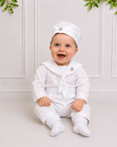 Koco Bino baby boy christening outfit with classic white sailor suit and matching hat, styled for a timeless baptism or special occasion in South Africa.