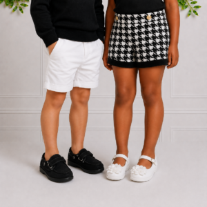 Kids shoes South Africa: stylish black boat shoes for boys and white floral Mary Janes for girls, perfect for smart occasions.