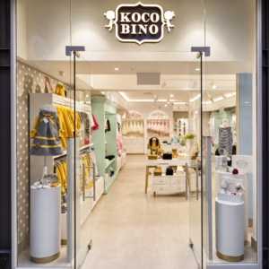 Koco Bino’s V&A Waterfront store in Cape Town, with a stylish entrance and displays showcasing a lovely range of children’s clothing and accessories.