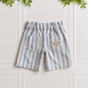 Back of boys' linen shorts in blue and white striped cotton linen with two patch pockets and Koco Bino label