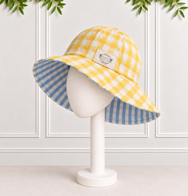 Girls' reversible sunhat in yellow and white gingham with blue and white striped reverse