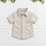 Boys’ stone and vanilla striped 100% linen shirt with short sleeves, classic collar and cream KB monogram embroidery.