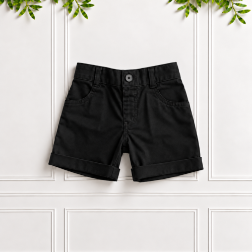 Boys black cotton shorts with a button fastening, belt loops, front pockets and rolled cuffs, displayed against a white panelled background by Koco Bino.