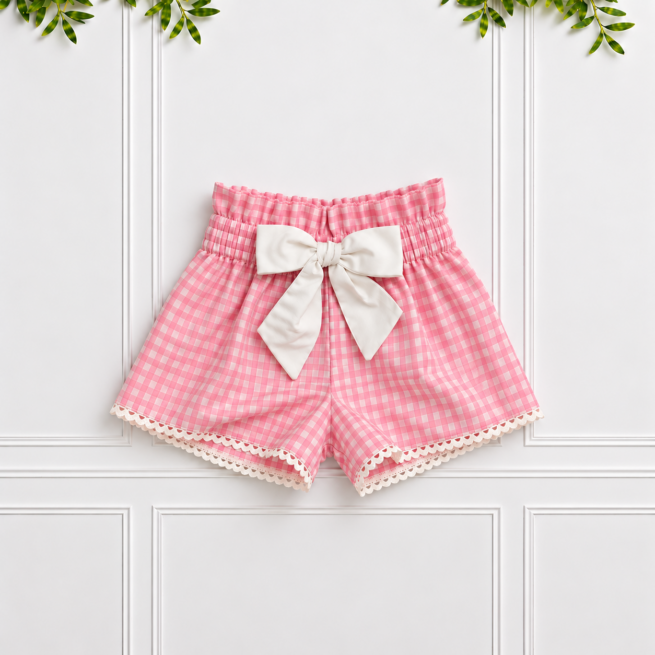 Girls’ Pink Gingham Shorts with white poplin bow and pompom edging by Koco Bino