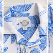 Boys Blue Palm Print Shirt close-up showing the tropical print, textured fabric, revere collar, Koco Bino logo, 6–12 months label and sleeve details.